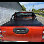 Load image into Gallery viewer, Toyota Hilux 2016-2020 Interceptor Manual Roller Shutter with Roll Bar and Cross Bars in Black