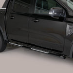 Load image into Gallery viewer, A black pickup truck shown from a side-rear angle, featuring silver metal running boards mounted along the side of the vehicle.