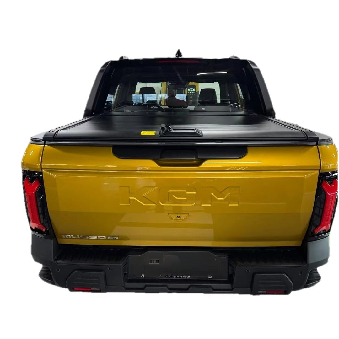 Yellow truck with a black tonneau cover, roller shutter