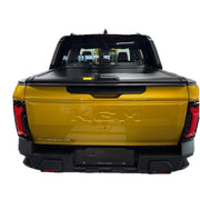 Yellow truck with a black tonneau cover, roller shutter
