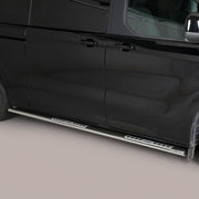 A black side step bar with chrome trim installed on the side of a black van, shown against a neutral studio background.