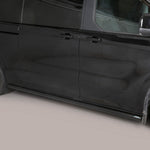 Load image into Gallery viewer, A black side view of a minivan with chrome wheels and a black side step bar installed along the lower side door.