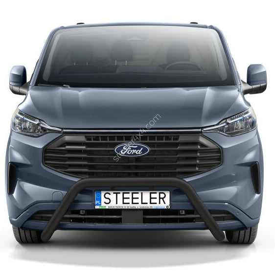 Front view of a blue-gray Ford Transit Custom van with a black front bull bar and a custom license plate reading 'STEELER', shown on a white background.