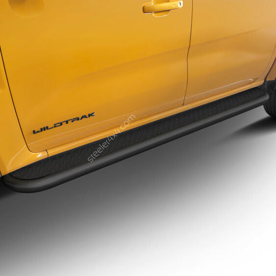 A close-up of a bright yellow Ford Wildtrak truck showing the side step protectors, door panel, and wheel area against a clean white studio background.