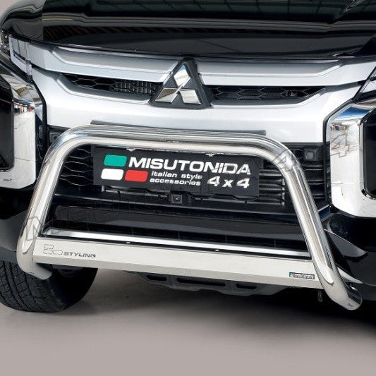 A close-up of a black Mitsubishi vehicle front grille with a polished silver Misutonida bull bar mounted below the grille.