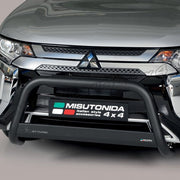 A close-up of the front bumper area of a silver Mitsubishi vehicle, showing a black Misutonida bull bar with a front license plate frame and a small Italian flag graphic.