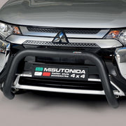 A close-up of the front bumper area of a silver Mitsubishi vehicle, showing a black Misutonida bull bar mounted across the front. The Mitsubishi logo is visible on the grille, and a Misutonida badge is attached to the bull bar.