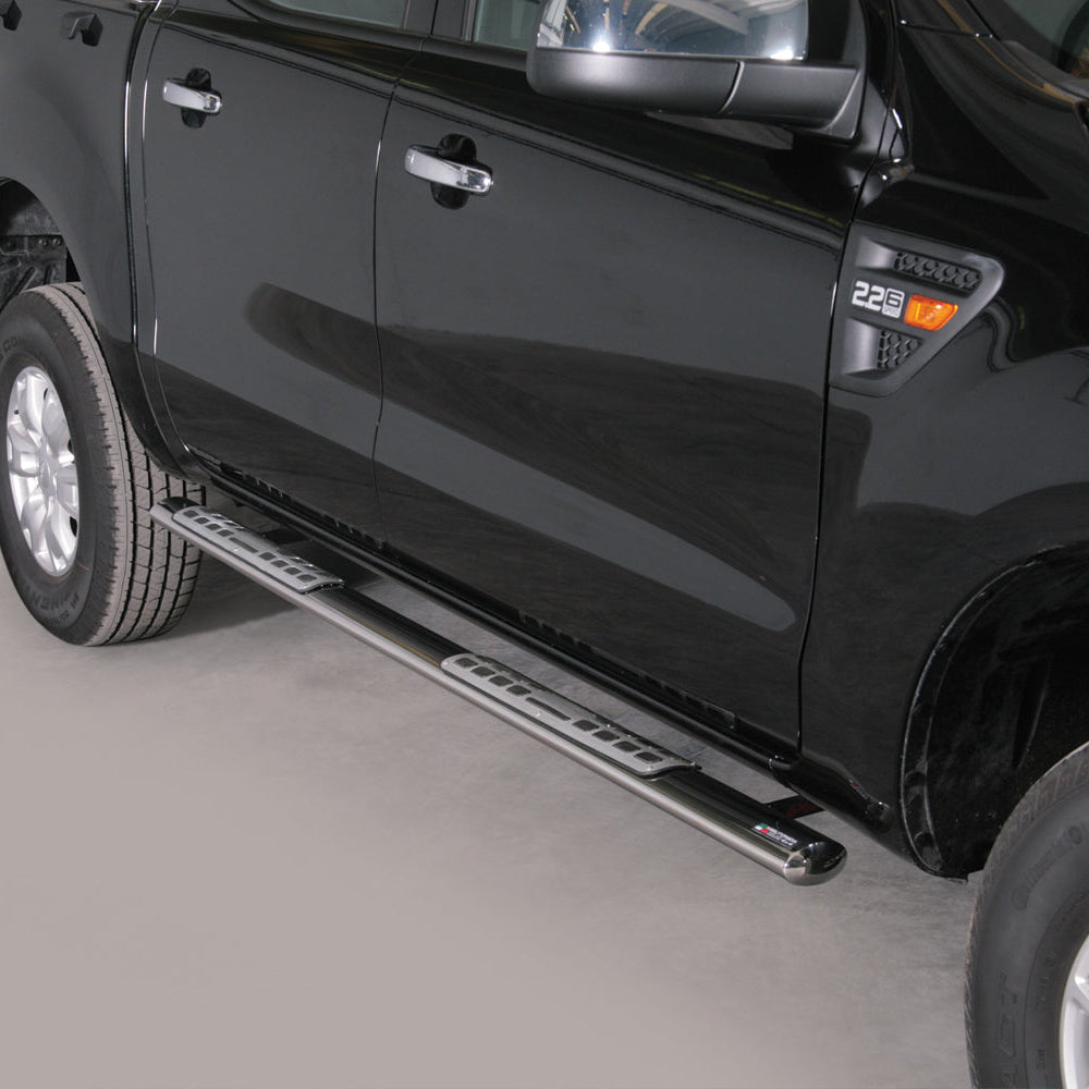 A pair of black metal truck side steps mounted on the side of a glossy black pickup truck, shown against a neutral gray studio background.