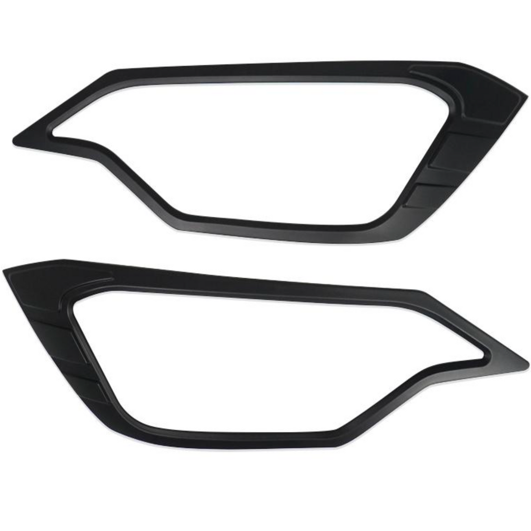Two black car headlight covers for Isuzu D-Max 2025-on