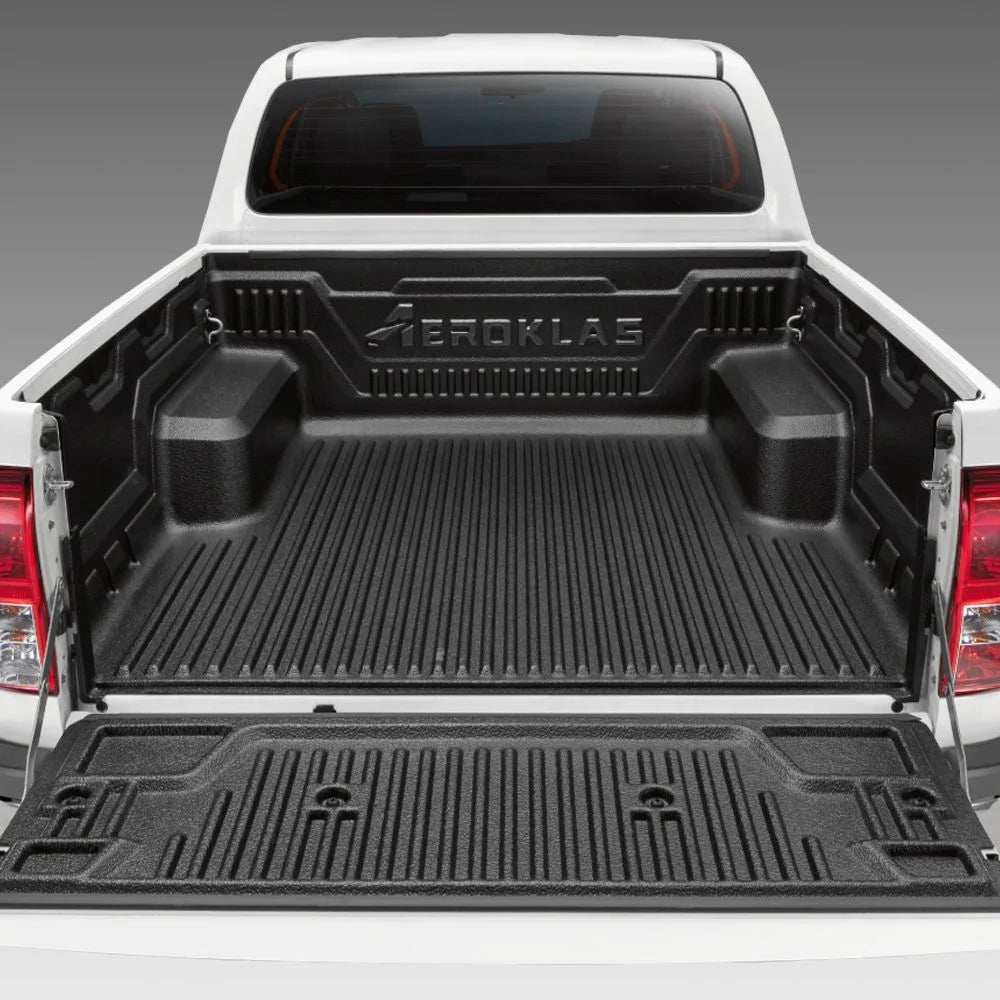 Black truck under rail bed liner with 'Aeroklas' branding on a truck Toyota Hilux.