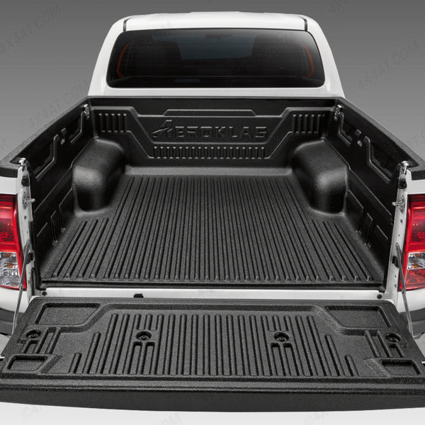 Black Toyota Hilux over rail bed liner installed in the bed of a pickup truck.