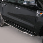 Load image into Gallery viewer, A close-up side view of a black pickup truck showing a long chrome side step running along the lower door, with part of the rear wheel and front wheel visible against a plain light gray studio background.