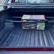 Cargo manager bars installed in pickup bed