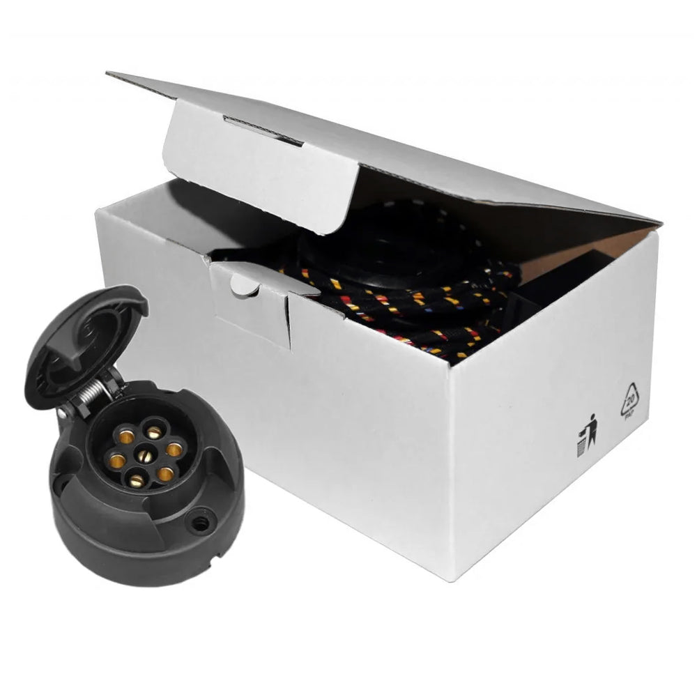 A 7-pin plug for a pickup truck towing electrics, displayed alongside its packaging box.